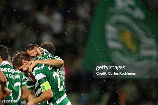 Sporting's midfielder Adrien Silva celebrating scoring Sporting's fourth goal with Sporting's defender Jefferson during the match between Sporting CP...