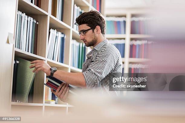 Library Guy 17,016 Guy Studying In Library Stock Photos, High-Res Pictures, and ...