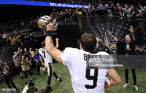 Drew Brees of the New Orleans Saints celebrates after defeating the Dallas Cowboys at Mercedes-Benz Superdome on October 4, 2015 in New Orleans,...