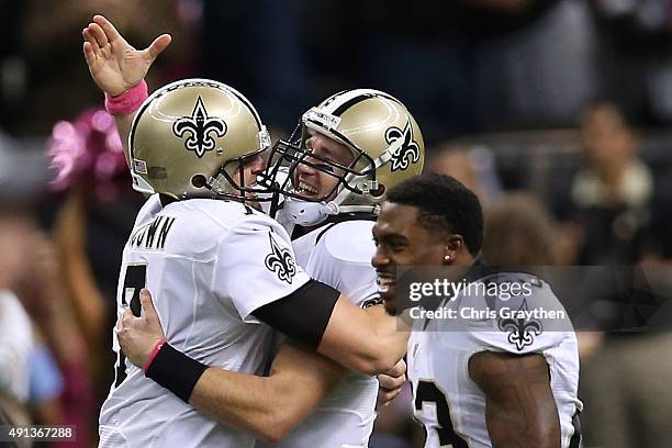 Drew Brees of the New Orleans Saints celebrates after throwing his 400th touchdown pass to C.J. Spiller of the New Orleans Saints in overtime to...