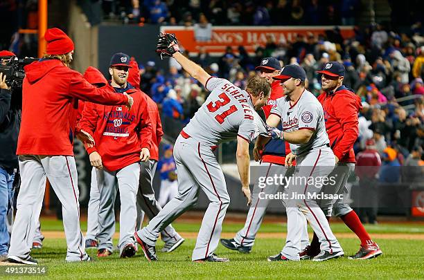 Max Scherzer of the Washington Nationals celebrates his no hitter against the New York Mets with his teammates at Citi Field on October 3, 2015 in...