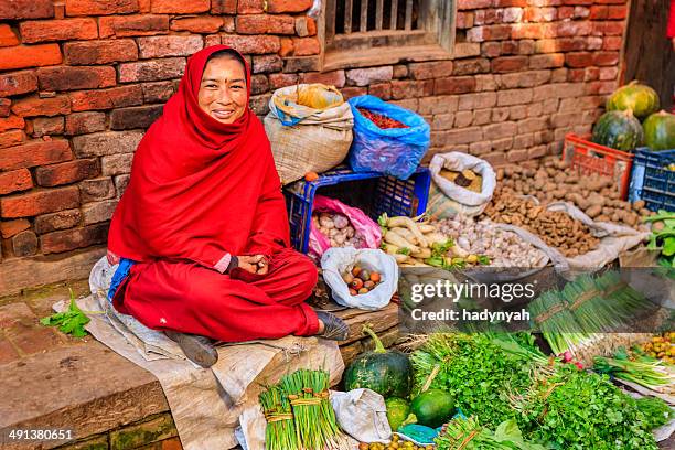 nepali vegetables seller in bhaktapur, near durbar square, nepal - nepal food stock pictures, royalty-free photos & images