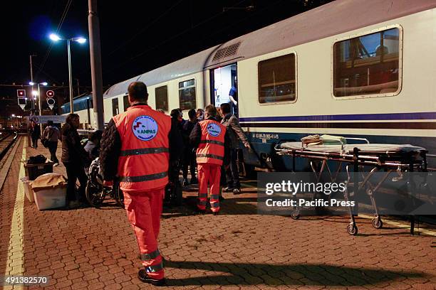 Volunteers prepare their stretchers for the pilgrims from the stranded trains. Two trains diverted from Lourdes arrived after midnight at Porta Nuova...