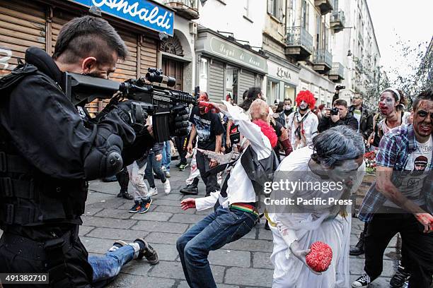 Participants dressed as zombies join in with the "Torino Zombie Walk" which was attended by hundreds of people in the streets of Turin.