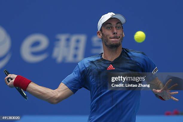 Andreas Haider-Maurer of Austria returns a shot against Jo-Wilfried Tsonga of France during the Men's singles first round match on day three of the...