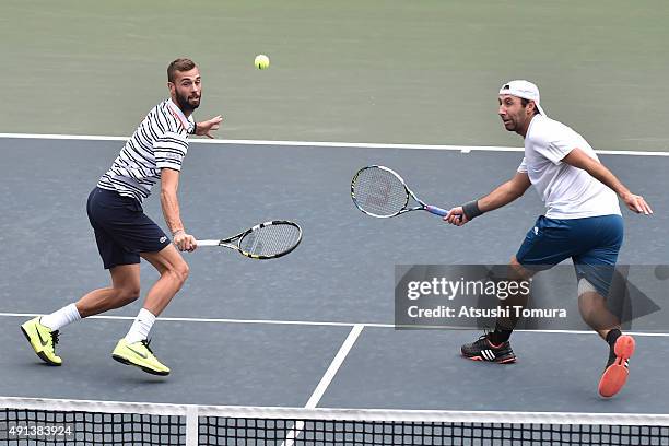 Benoit Paire of France and Santiago Gonzales of Mexico compete against Fernando Verdasco of Spain and Richard Gasquet of France during the men's...