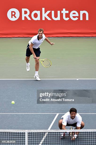 Richard Gasquet of France and Fernando Verdasco of Spain compete against Santiago Gonzales of Mexico and Benoit Paire of France during the men's...
