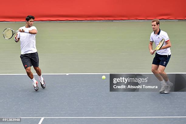 Fernando Verdasco of Spain and Richard Gasquet of France compete against Santiago Gonzales of Mexico and Benoit Paire of France during the men's...