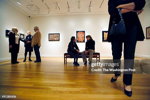 Guests linger in the room dedicated to the work of Alfonso Ossorio, American artist and patron, at the Phillips Collection exhibition preview and...