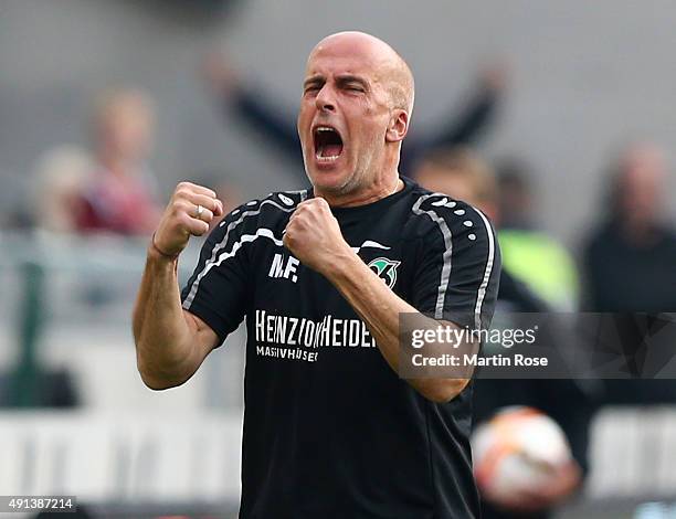 Michael Frontzeck,head coach of Hannover celebrates after the Bundesliga match between Hannover 96 and Werder Bremen at HDI-Arena on October 3, 2015...