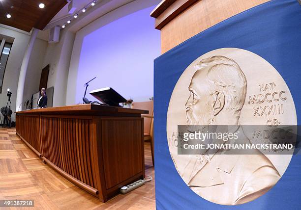 The laureate medal featuring the portrait of Alfred Nobel is seen before a press conference of the Nobel Committee to announce the winner of the 2015...