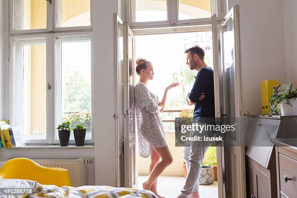 couple arguing in the morning at home - couple talking stock pictures, royalty-free photos & images