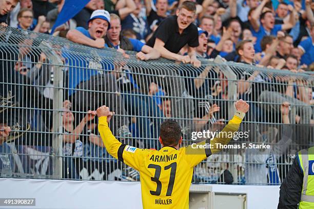 Christian Mueller of Bielefeld celebrates his teams first goal in front of the Bielefeld supporters during the Second Bundesliga Playoff First Leg...