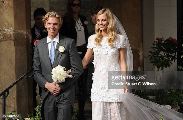 James Cook and Poppy Delevingne depart St. Pauls Church in Knighstbridge after thier wedding on May 16, 2014 in London, England.