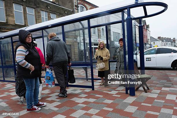 People wait at a bus stop in Redcar ahead of a visit by the Labour Shadow Chancellor John McDonnell for a meeting with steelworkers and their...