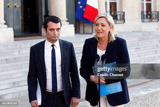 French far-right Front National party president Marine Le Pen with FN vice-president Florian Philippot speaks to the media after a meeting with...