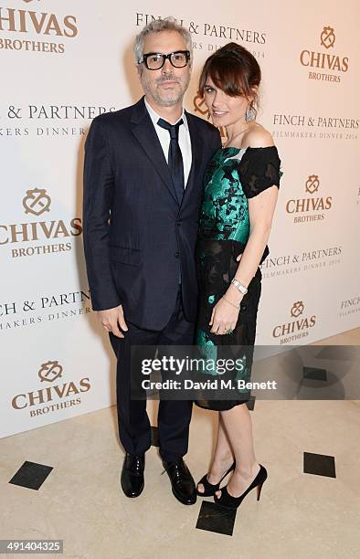 Alfonso Cuaron and Sheherazade Goldsmith attend the annual Charles Finch Filmmakers Dinner during the 67th Cannes Film Festival at Hotel du...