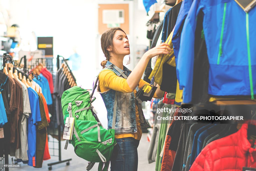 Woman shopping in outdoor equipment mega store