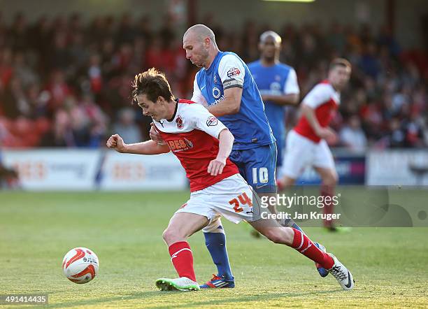 Nigel Penn of York City battles for the ball with Josh Morris of Fleetwood Town during the Sky Bet League Two play off Semi Final second leg match...