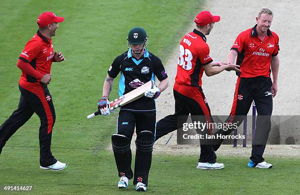 Paul Collingwood of Durham Jets celebrates the wicket of Alexei Kervezee with team-mate Mark Wood during the Natwest T20 Blast match between Durham...