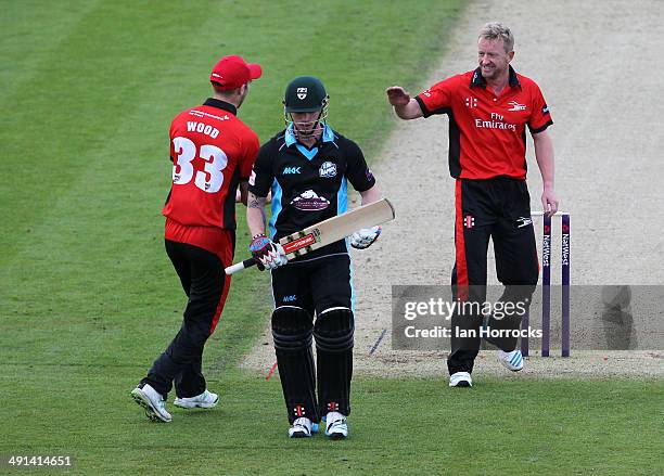 Paul Collingwood of Durham Jets celebrates the wicket of Alexei Kervezee with team-mate Mark Wood during the Natwest T20 Blast match between Durham...