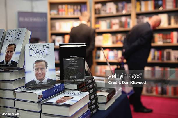 Visitors look at a boom stand, where Lord Ashcroft's controversial book 'Call Me Dave' is on display on the second day of the Conservative party...