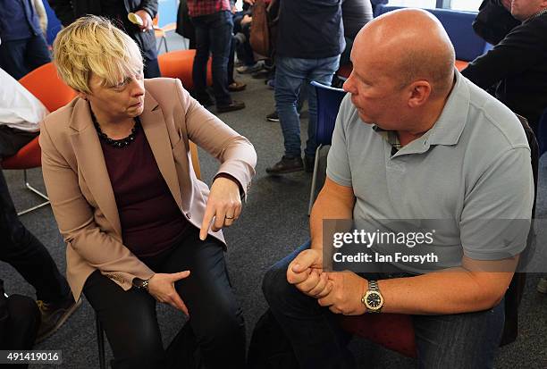 Labour Shadow Business Secretary Angela Eagle talks to steelworker Brian Dennis as she met with steelworkers and their families, trade union...