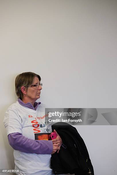 Family member wearing a Save our Steel t-shirt waits against a wall as Shadow Chancellor John McDonnell meets with steelworkers and their families,...