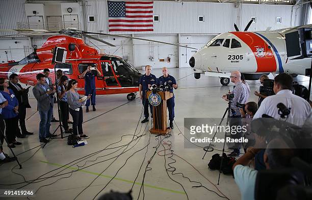 Coast Guard Lt. Commander Gabe Somma stands next to U.S. Coast Guard Captain Mark Fedor as he speaks to the media at U.S. Coast Guard Station Miami,...