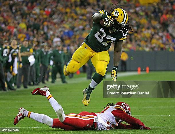 Eddie Lacy of the Green Bay Packers leaps over Ron Parker of the Kansas City Chiefs to run for a first down at Lambeau Field on September 28, 2015 in...