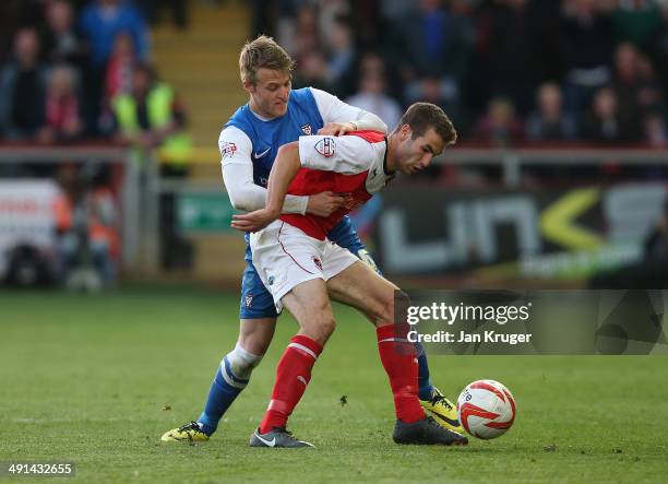 Will Hayhurst of York City battles with Matty Blair of Fleetwood Town during the Sky Bet League Two play off Semi Final second leg match between...