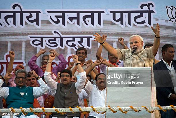 Leader Narendra Modi gestures while speaking to supporters after his landslide victory in elections on May 16, 2014 in Vadodara, India. Early...