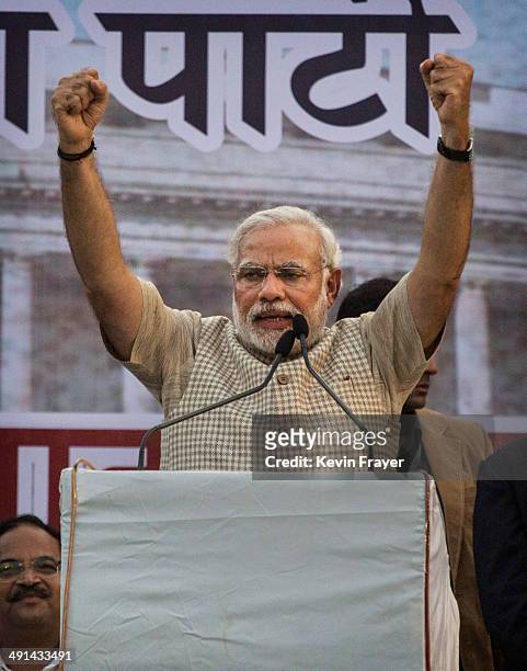 Leader Narendra Modi gestures while speaking to supporters after his landslide victory in elections on May 16, 2014 in Vadodara, India. Early...