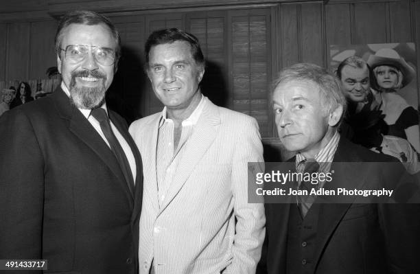Television producer George Schlatter with actor Cliff Robertson and actor Henry Gibson at Rowan & Martin's Laugh In cast reunion in 1983 in Los...