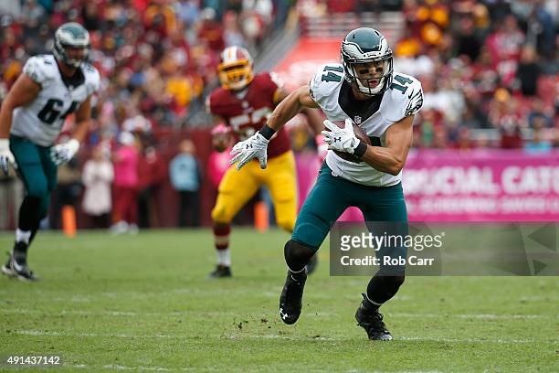 Riley Cooper of the Philadelphia Eagles runs with the ball after making a second half catch against the Washington Redskins at FedExField on October...