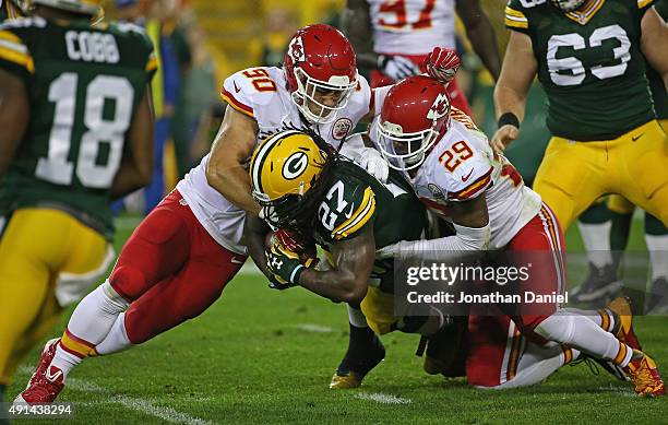 Eddie Lacy of the Green Bay Packers is dropped by Josh Mauga and Eric Berry of the Kansas City Chiefs at Lambeau Field on September 28, 2015 in Green...
