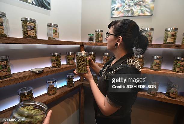 Woman shops at Oregon's Finest, a marijuana dispensary in Portland, Oregon, on October 4, 2015. As of October 1, 2015 limited amounts of recreational...