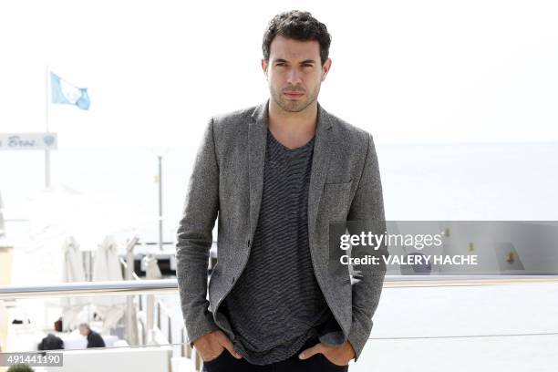 Welsh actor Tom Cullen poses for the photocall of the TV series "The Five" at the MIPCOM audiovisual trade fair in Cannes, southeastern France, on...