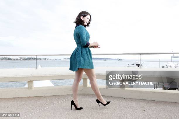 British actress Lily James poses for the photocall of the TV series "War and Peace" during the MIPCOM audiovisual trade fair in Cannes, southeastern...