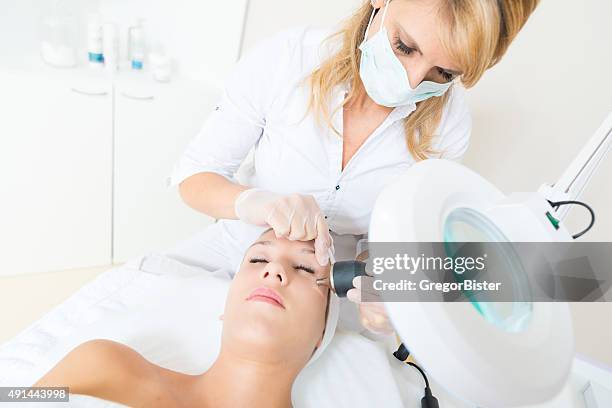 face treatment - beauty laser stock pictures, royalty-free photos & images