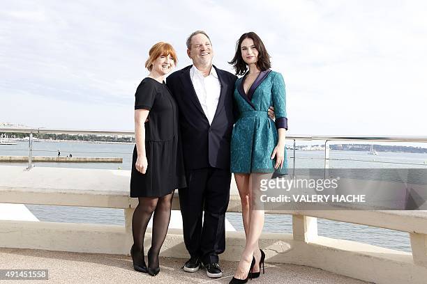 Executive Producers Faith Penhale and Harvey Weinstein and British actress Lily James pose for the photocall of the TV series "War and Peace" during...
