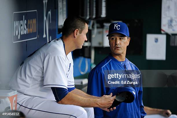 Dave Eiland pitching coach of the Kansas City Royals talks with Chris Young during a game against the Cleveland Indians at Kauffman Stadium on...