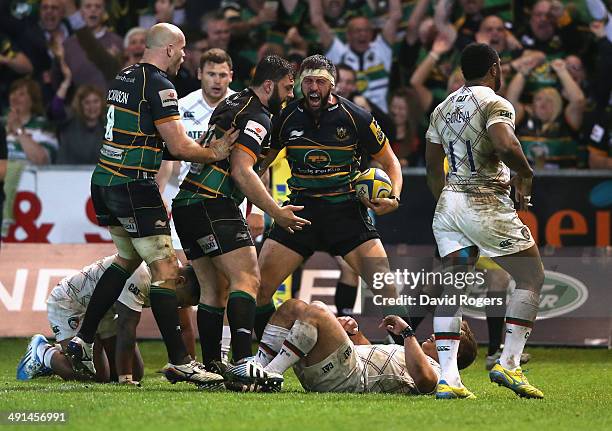 Tom Wood of Northampton Saints celebrates with team mates after scoring the last minute match winning try during the Aviva Premiership semi final...