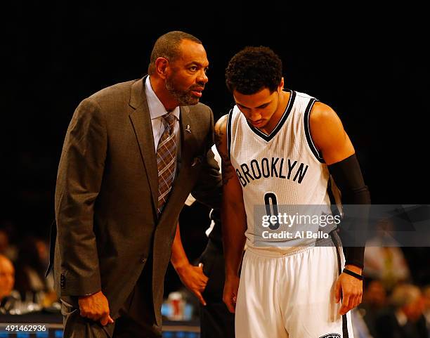 Head Coach Lionel Hollins of the Brooklyn Nets speaks to Shane Larkin of the Brooklyn Nets during their Pre Season game against Fenerbahce at the...