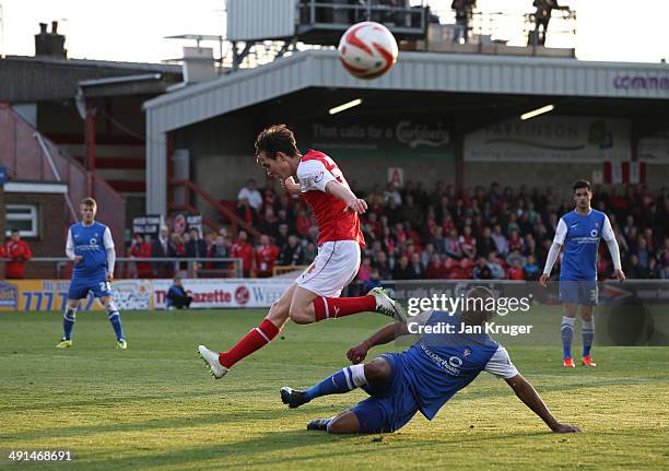 Lanre Oyebanjo of York City battles for the ball with Josh Morris of Fleetwood Town during the Sky Bet League Two play off Semi Final second leg...