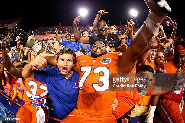 Martez Ivey of the Florida Gators celebrates in the stands with fans after defeating the Mississippi Rebels in the game on October 3, 2015 in...