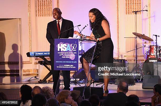 Assemblyman Keith Wright and Secretary of the Board of Directors at the Harlem School of the Arts, Janice Savin Williams appear onstage during the...
