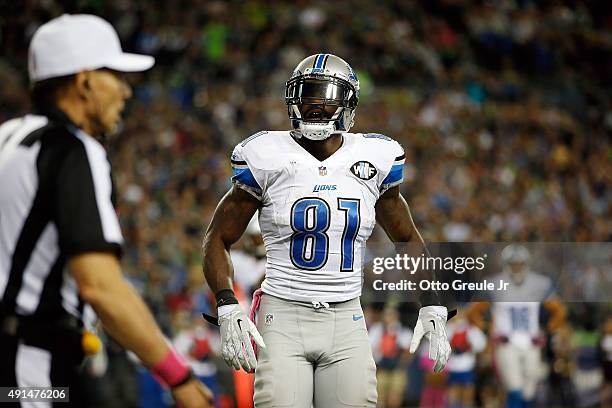 Calvin Johnson of the Detroit Lions reacts after fumbling the ball near the goal line during the fourth quarter of a game against the Seattle...