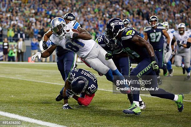 Calvin Johnson of the Detroit Lions dives for the end zone during the fourth quarter of a game against the Seattle Seahawks at CenturyLink Field on...