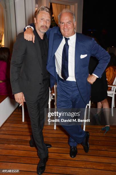 Mads Mikkelsen and Charles Finch attend the annual Charles Finch Filmmakers Dinner during the 67th Cannes Film Festival at Hotel du Cap-Eden-Roc on...